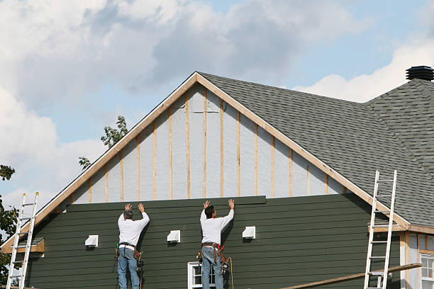 Professional Storm Damage Siding Repair technician working in LaFayette, GA
